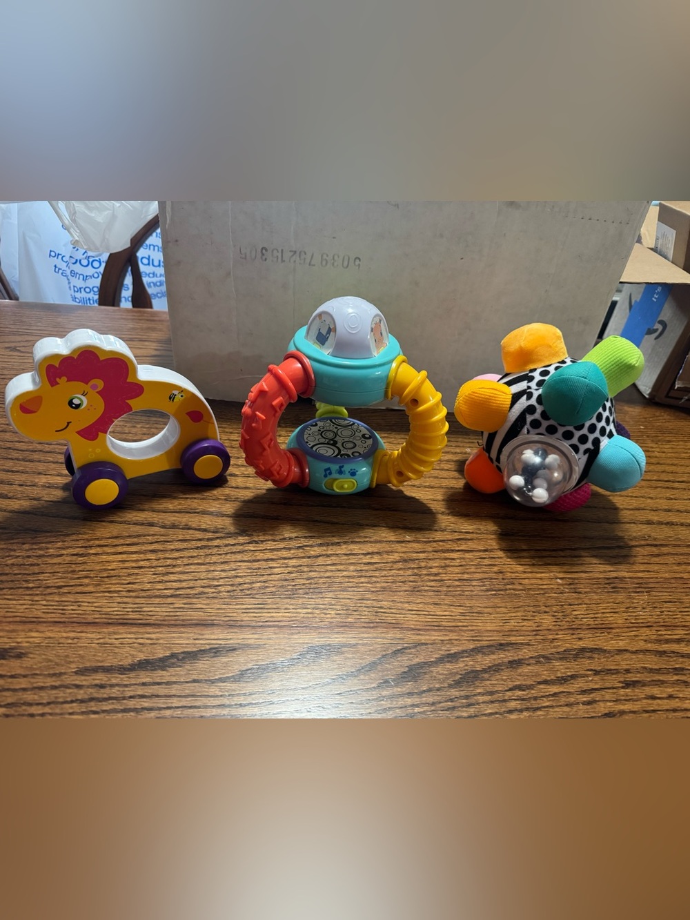 Interactive Red, Yellow & Teal Baby Rattle and Teether Toy